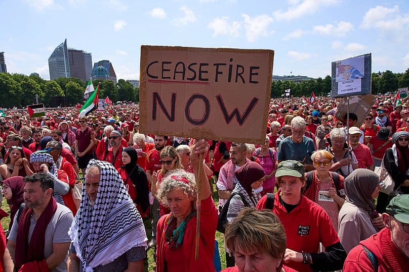 Fact Check: Tens of thousands of red-clad protesters marched in The Hague, Netherlands, on June 15, 2025, demanding the Dutch government take more action to halt Israel's campaign in Gaza.