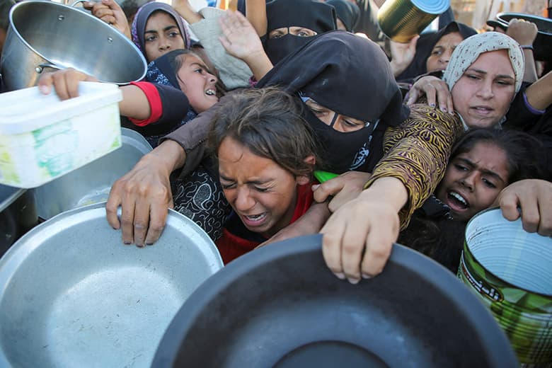 Fact Check: Desperate Gazans wait hours for food handouts amid violence.