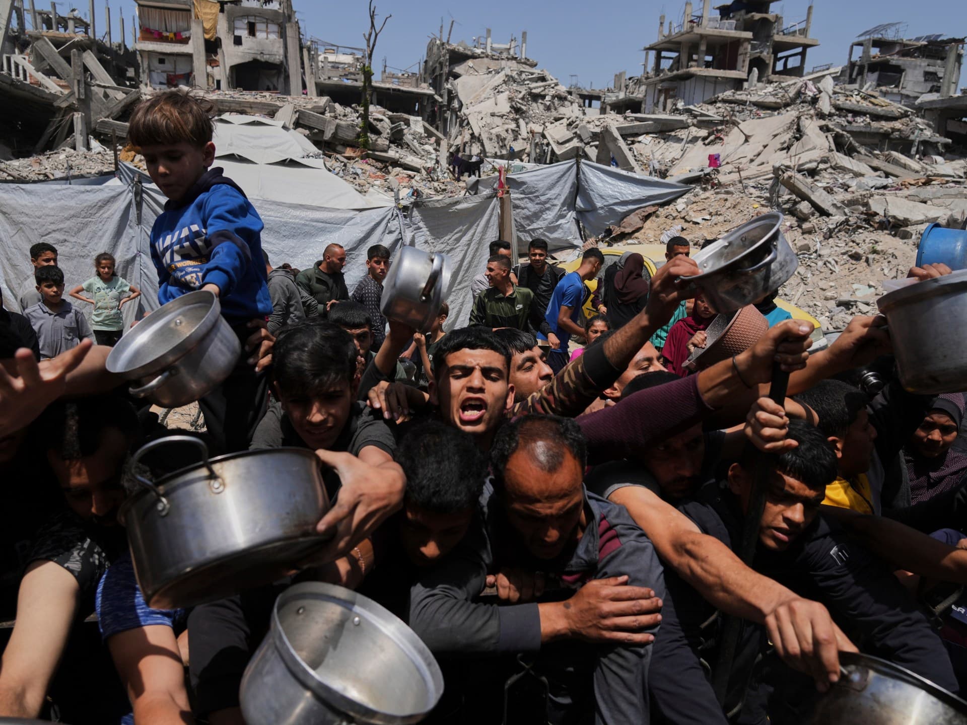 Fact Check: Witnesses describe chaotic scene as Israeli forces fire on fleeing crowds.