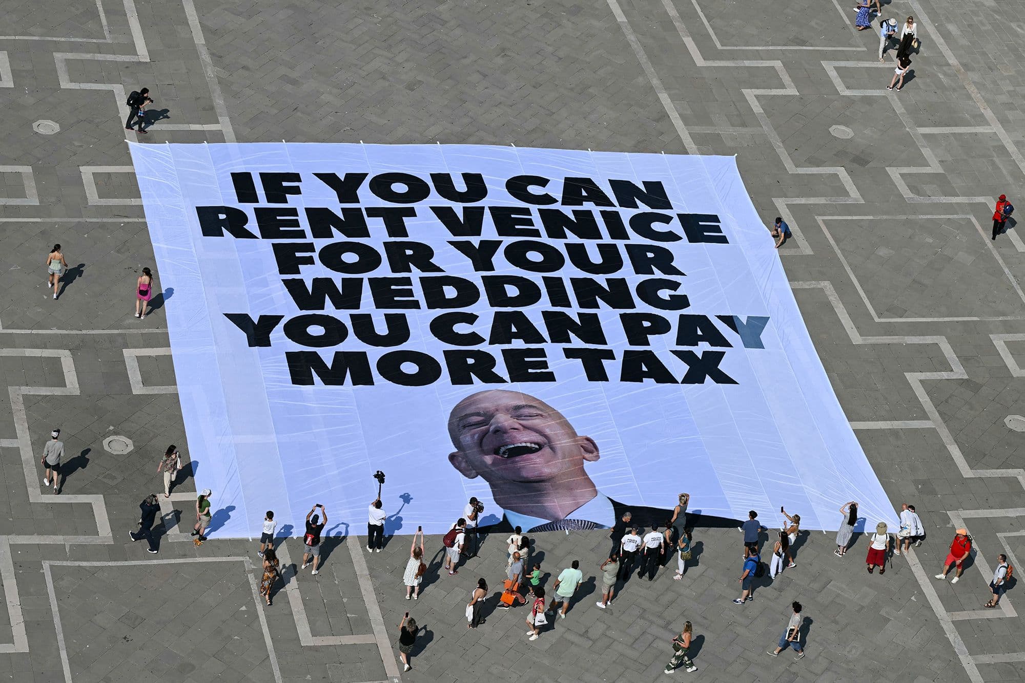 Fact Check: Greenpeace protests Bezos wedding, demanding billionaires pay higher taxes.