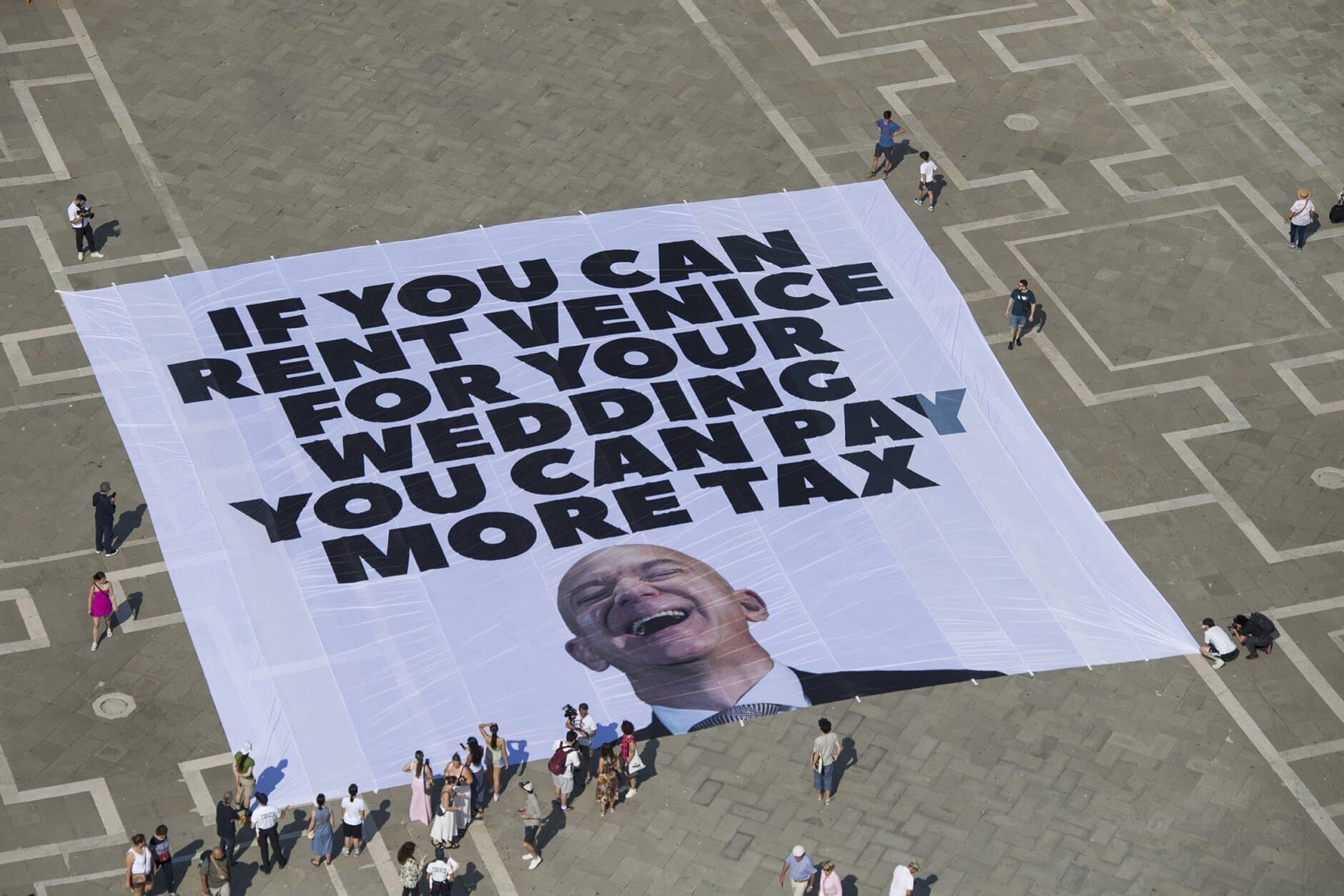 Fact Check: Greenpeace protests Bezos's wedding, highlighting billionaire tax breaks.