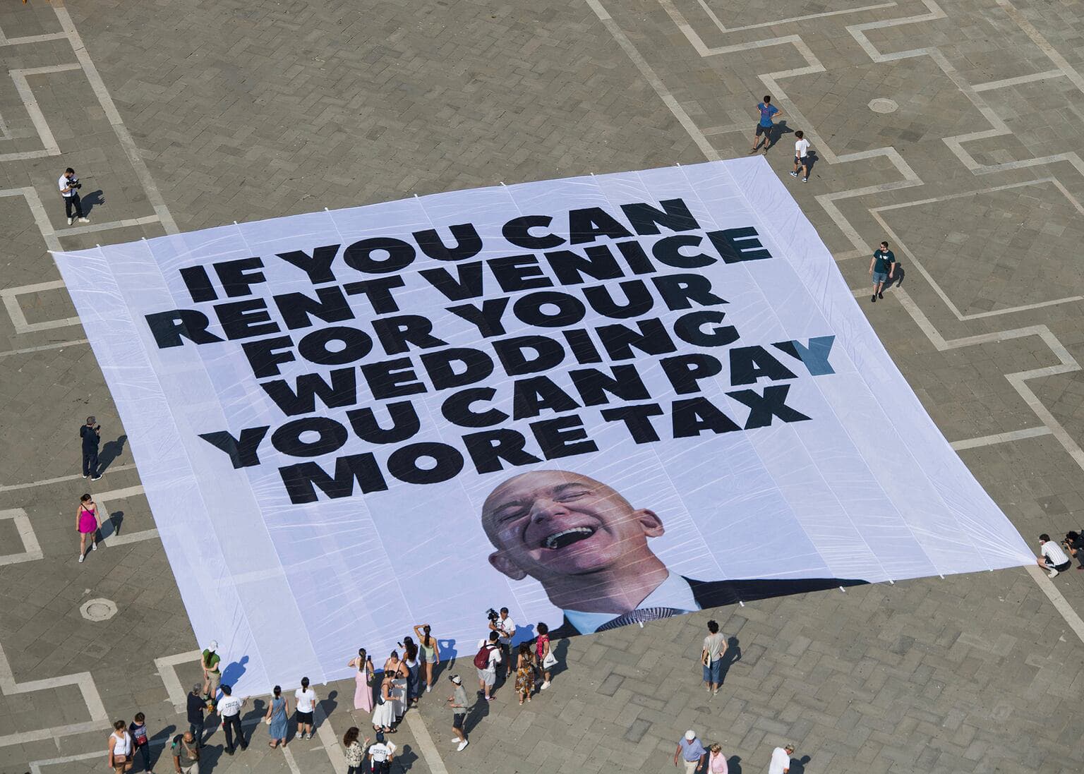 Fact Check: Greenpeace joins protests against Bezos's tax breaks at his wedding.