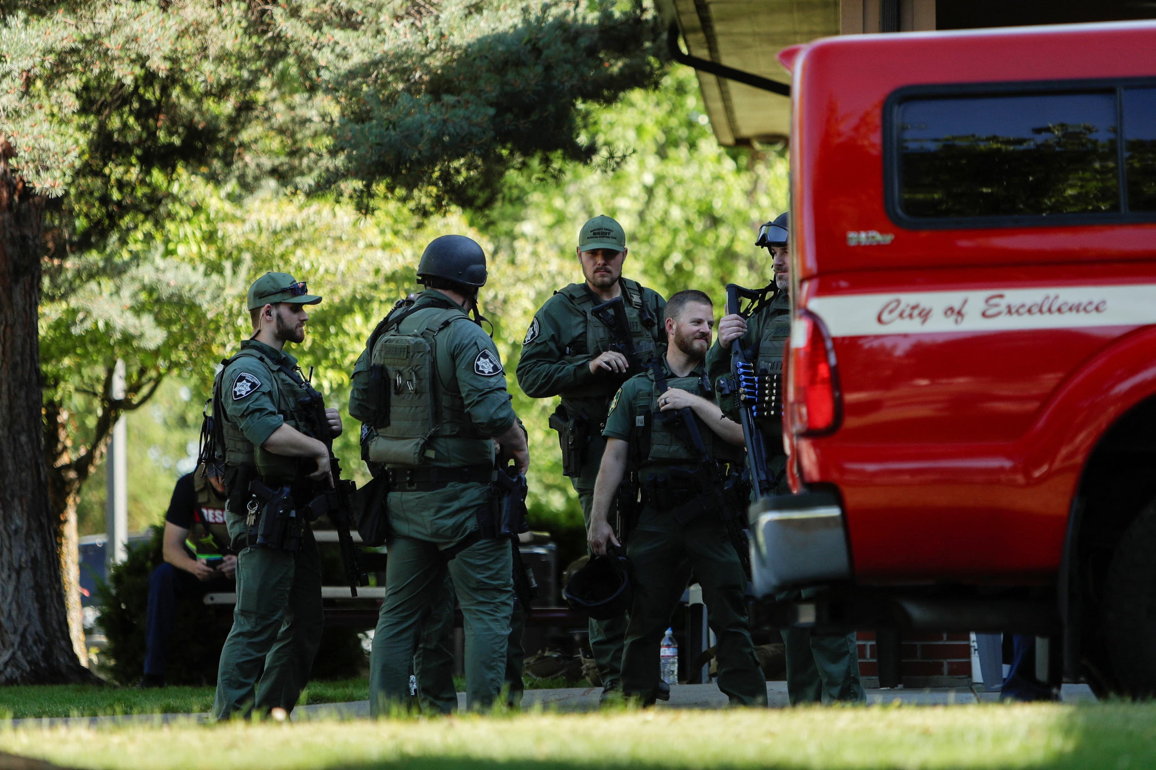 Fact Check: Sheriff confirms active sniper fire during the firefighting operation.